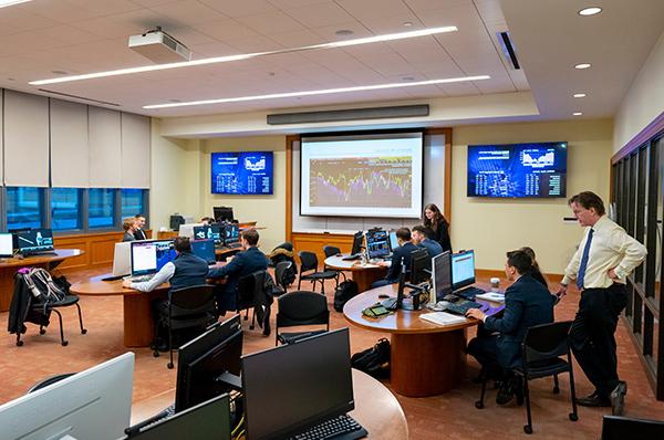 Photo of students and faculty in the Investment Center